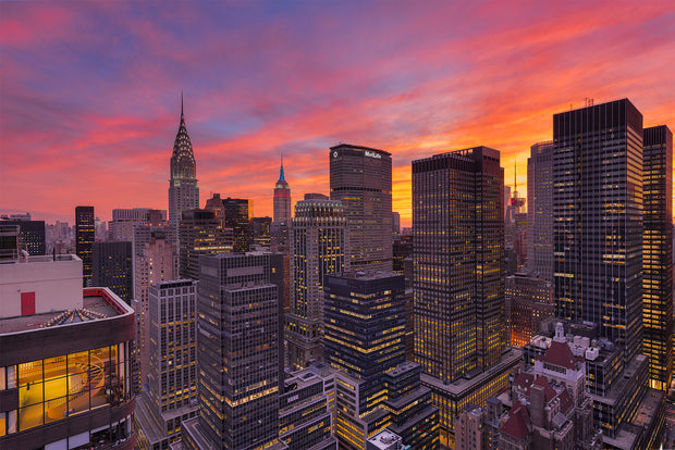 Fire in the sky over New York City during sunset by Kirit Prajapati
