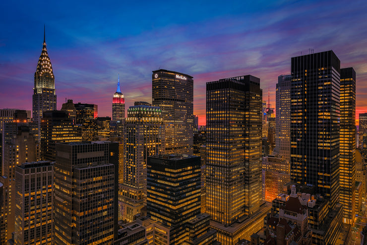 New York City with the Empire State Building lit in Red White and Blue at sunset by Kirit Prajapati